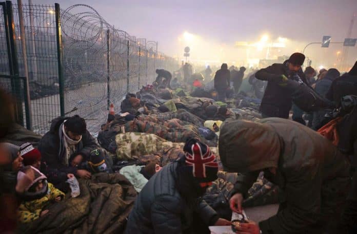 APTOPIX Migration Belarus Poland